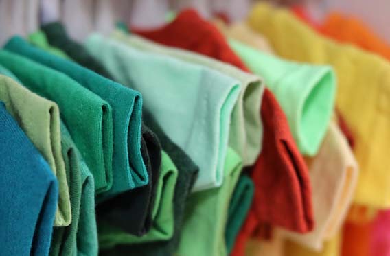 rack of colourful t-shirts